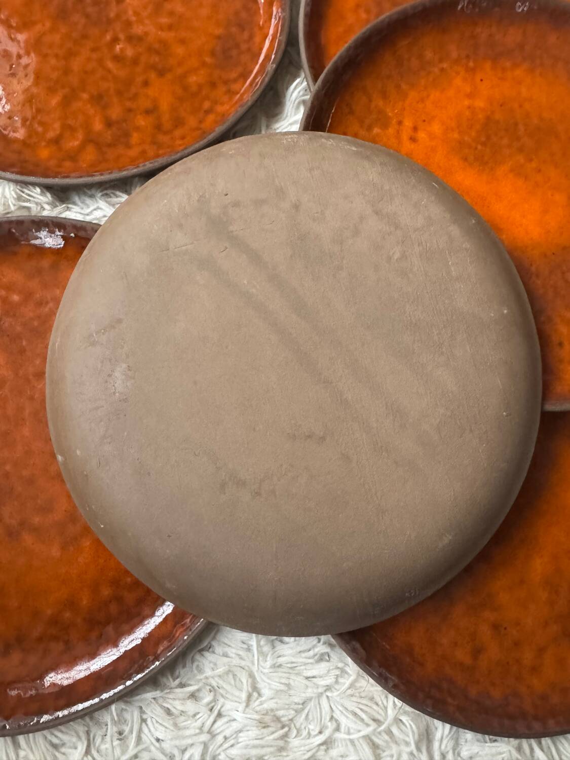 Orange glazed ceramic plates from the 1970s