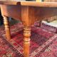 Oval drop-leaf coffee table