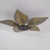 Ceiling light with perforated brass petals.