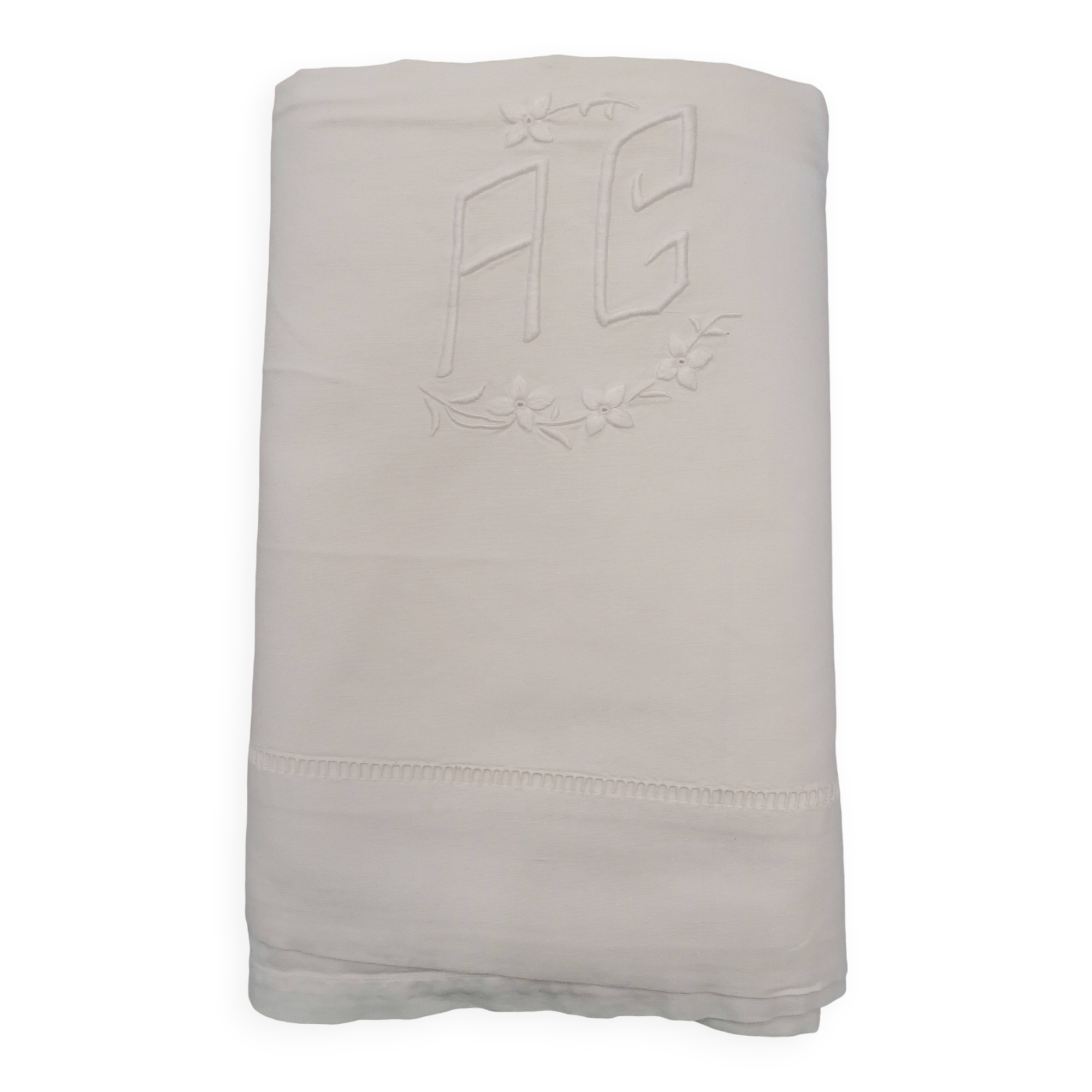 Antique white flat sheet embroidered with “AG”