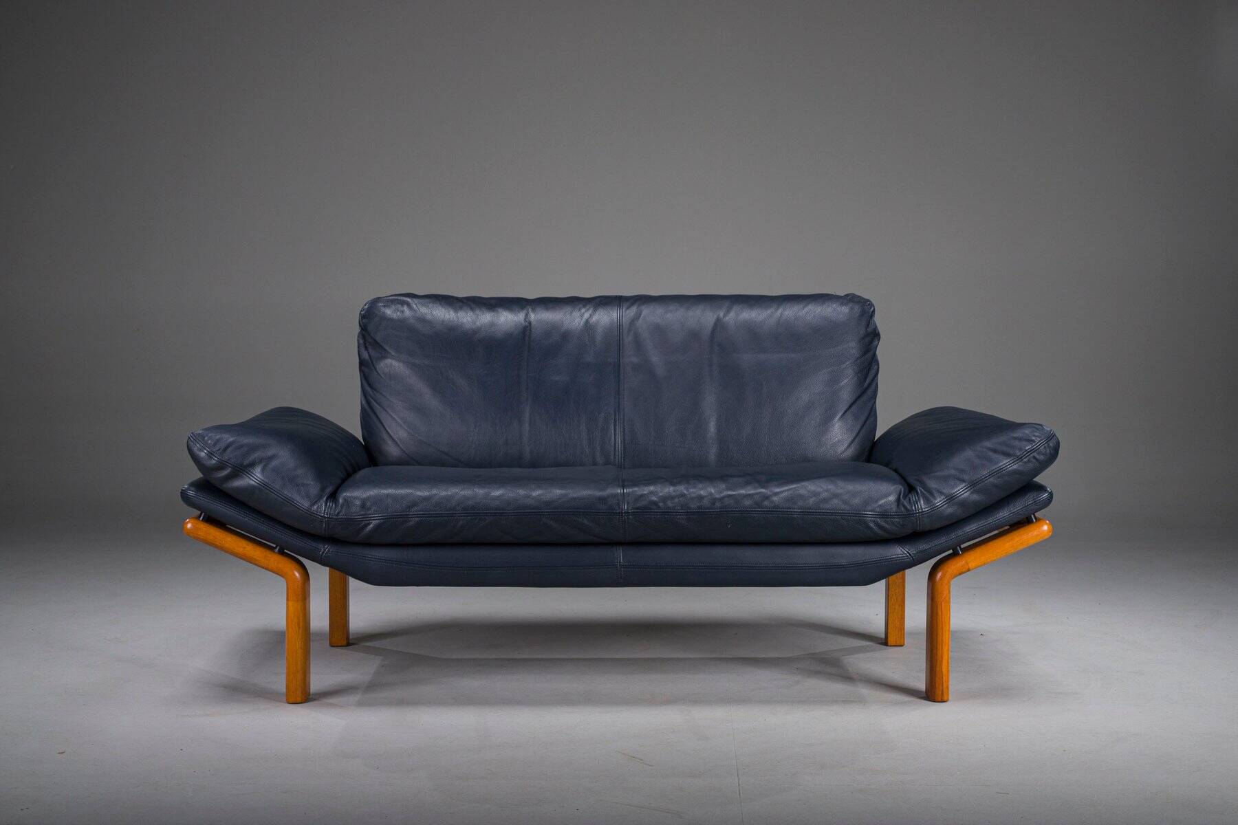 Danish teak and navy blue leather 2-seater sofa from Komfort, 1970s