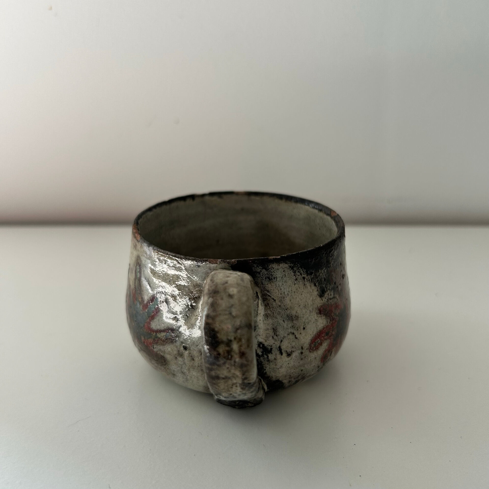 Handcrafted mug with floral decoration