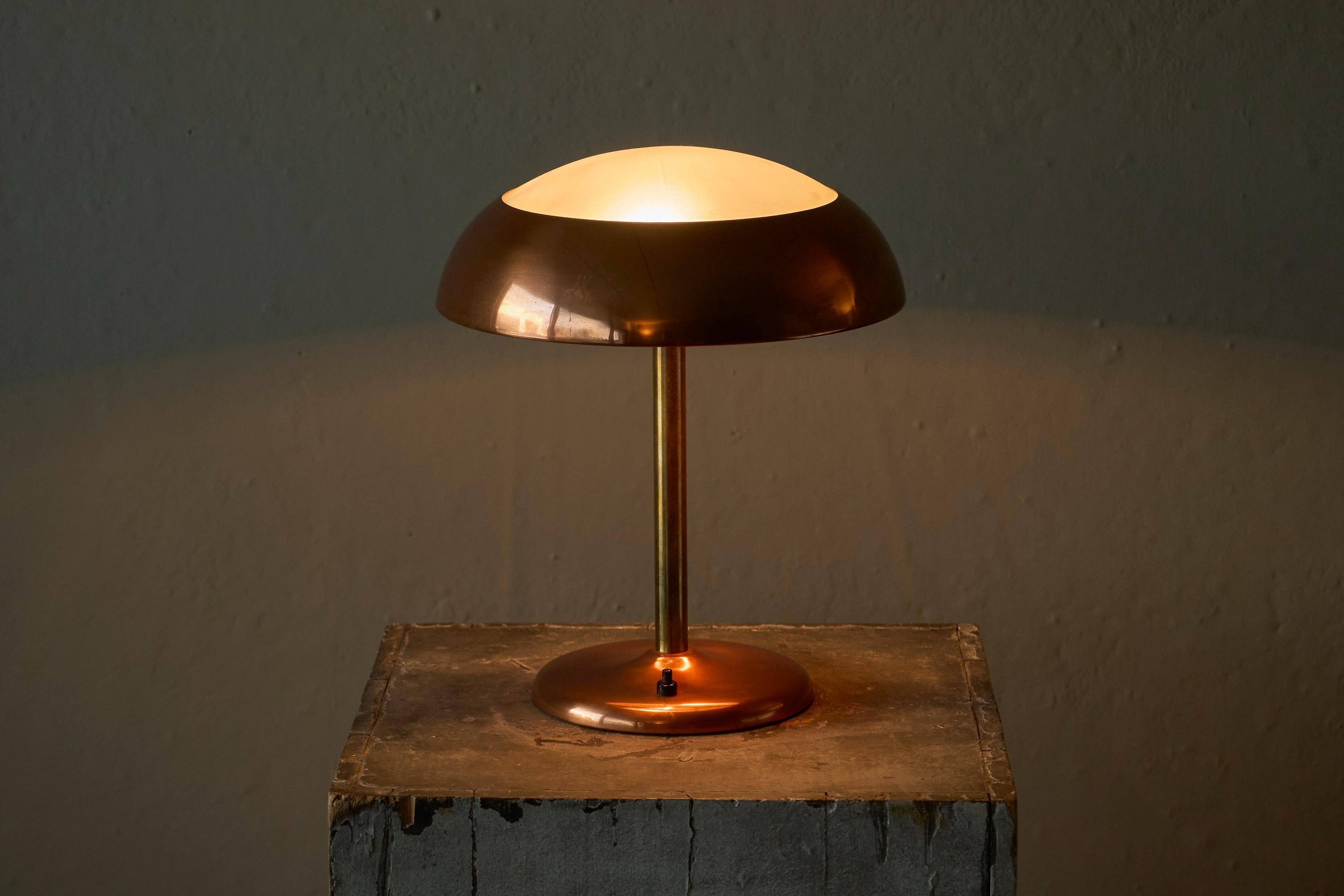 Art Deco table lamp in patinated copper, brass, and satin glass from the 1950s.