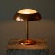 Art Deco table lamp in patinated copper, brass, and satin glass from the 1950s.