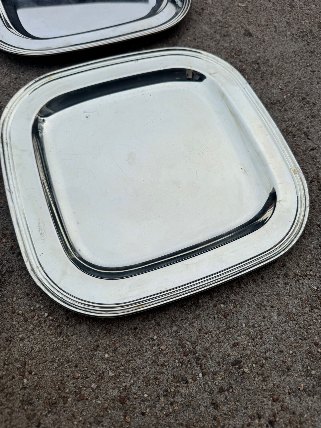 Silver-plated metal underplates from the 1980s.