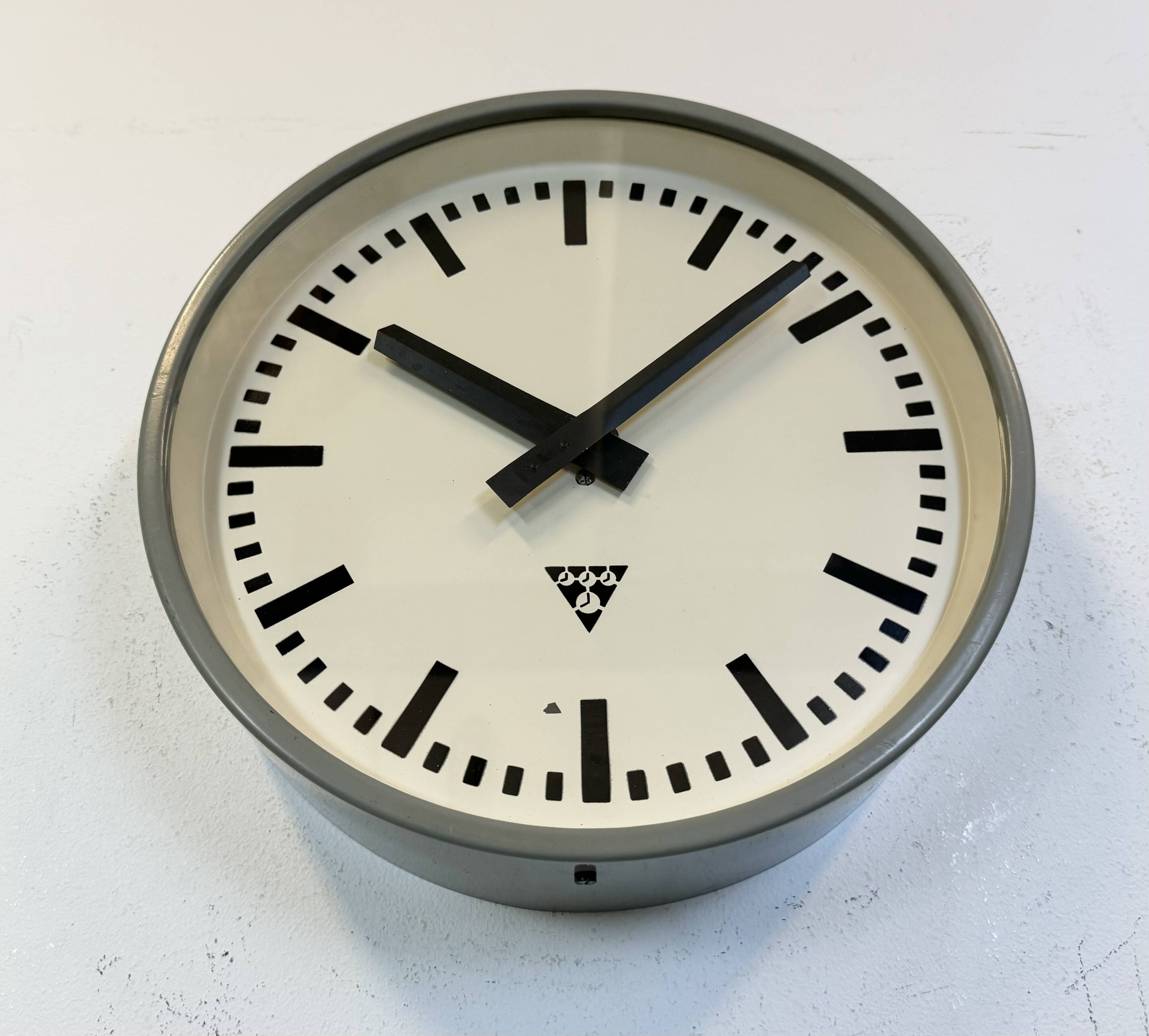 Industrial grey factory wall clock from pragotron, 1960s