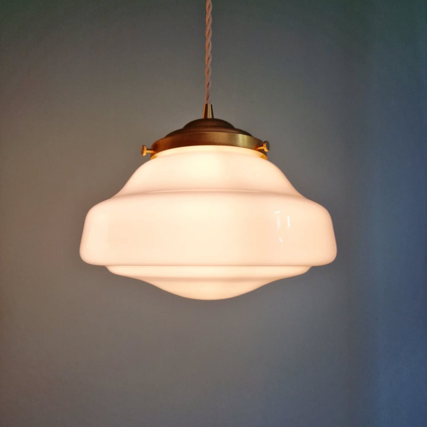 Pair of Art Deco pendant lights in white opaline.