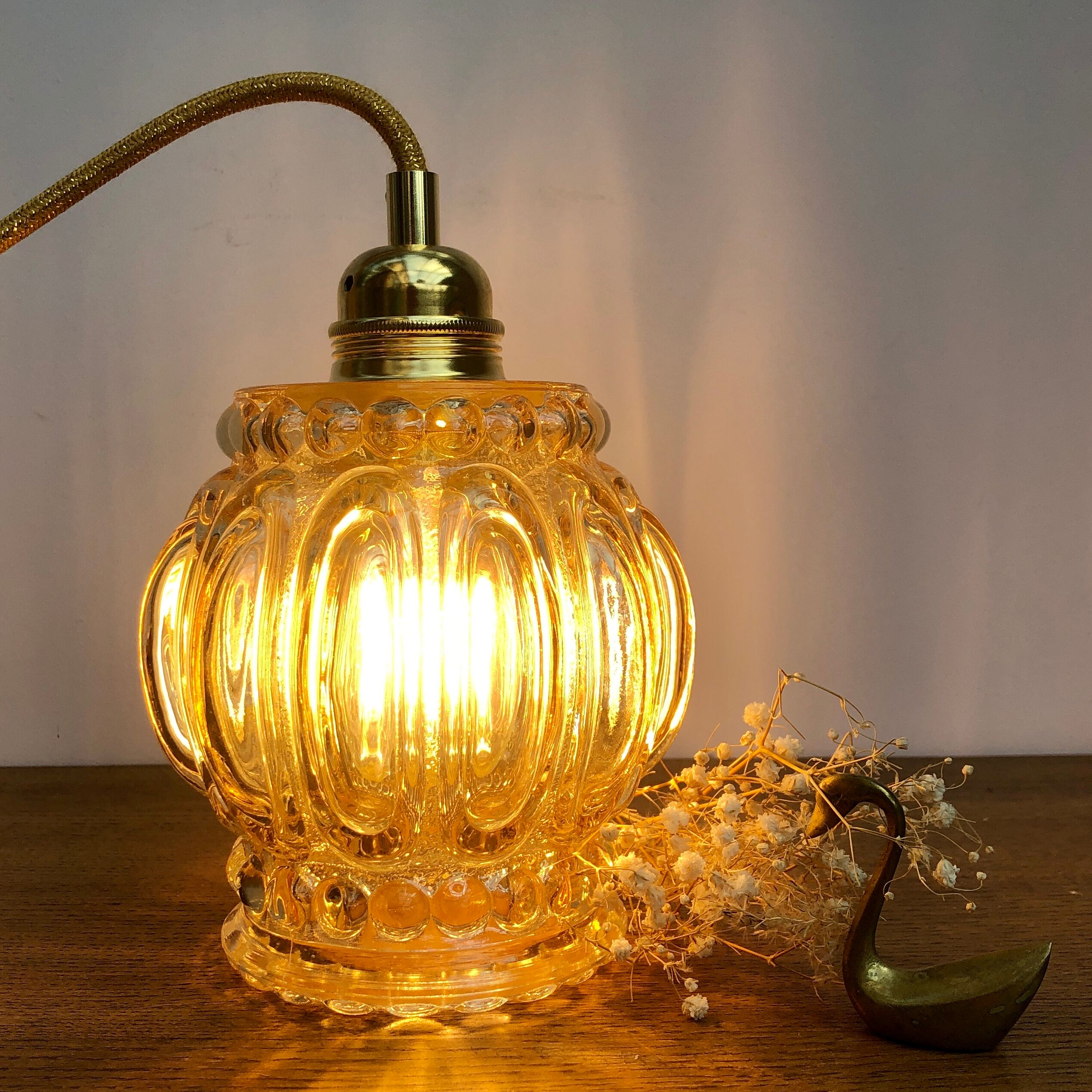Vintage amber glass globe hand lamp