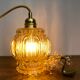 Vintage amber glass globe hand lamp