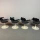 A striking set of four vintage swivel dining chairs