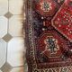 Large antique Oriental hallway carpet made of hand-knotted wool.