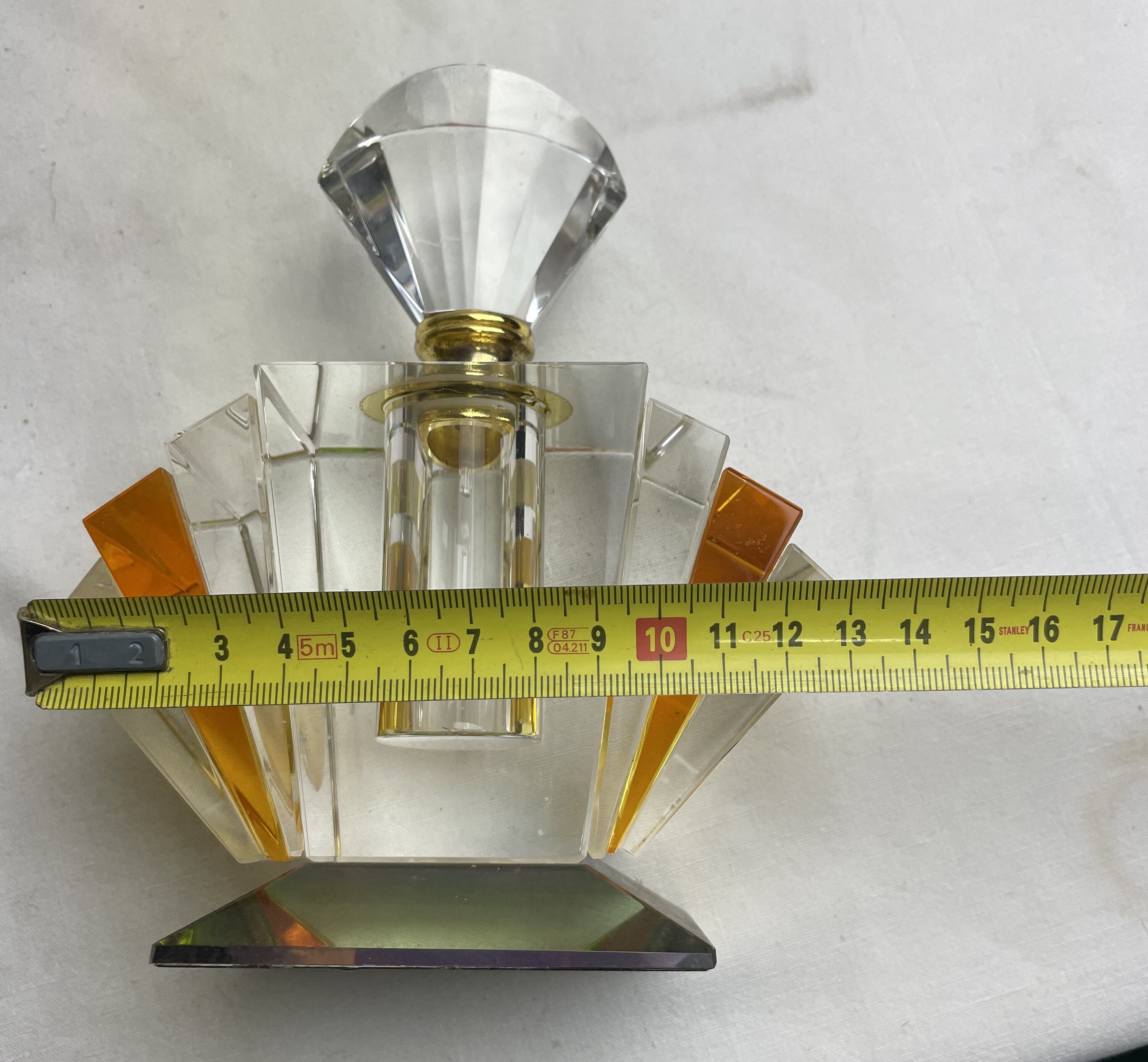 Empty art deco perfume bottle in amber crystal