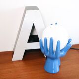 Ceramic lamp hands holding blue globe