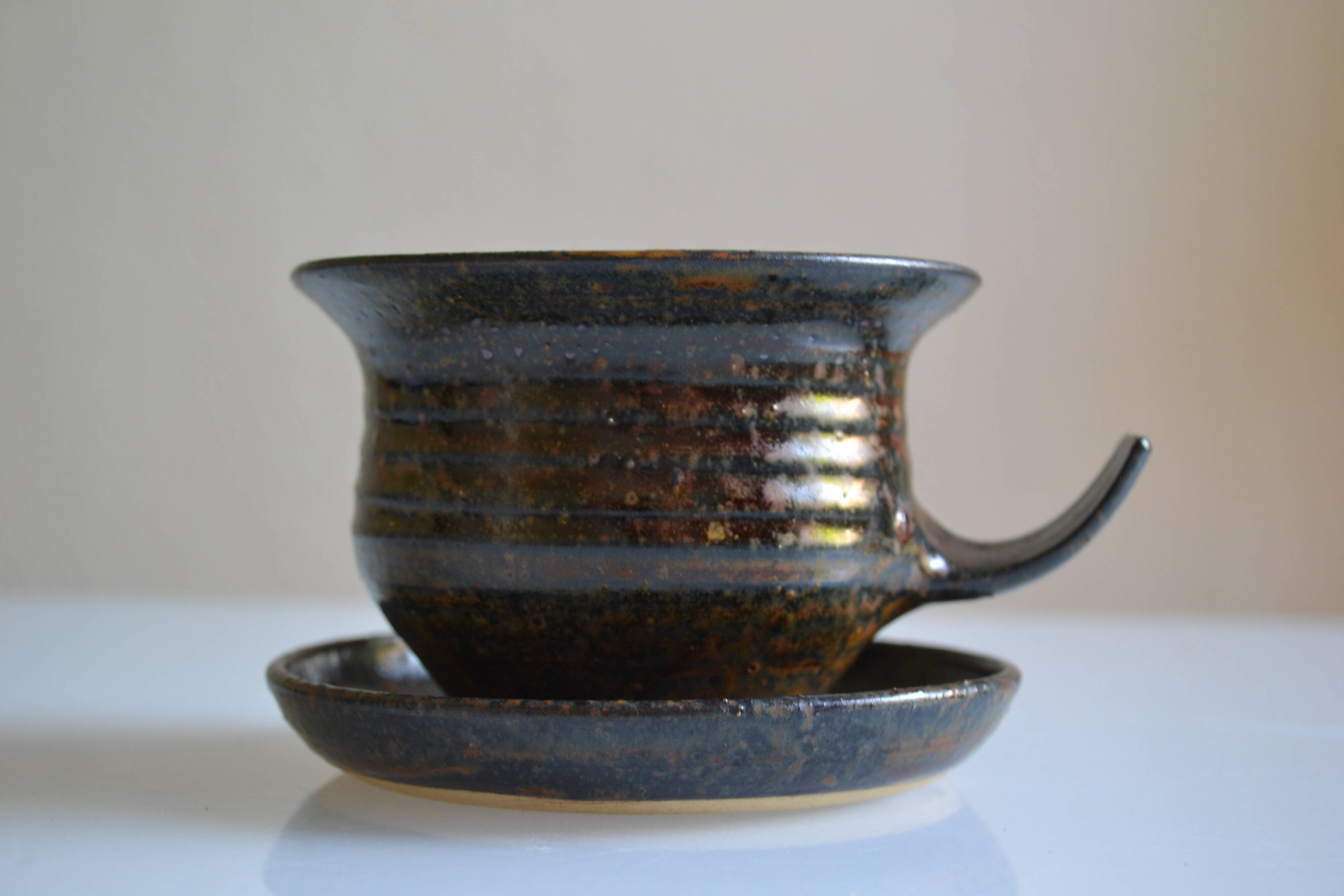1970s ceramic cup and saucer signed