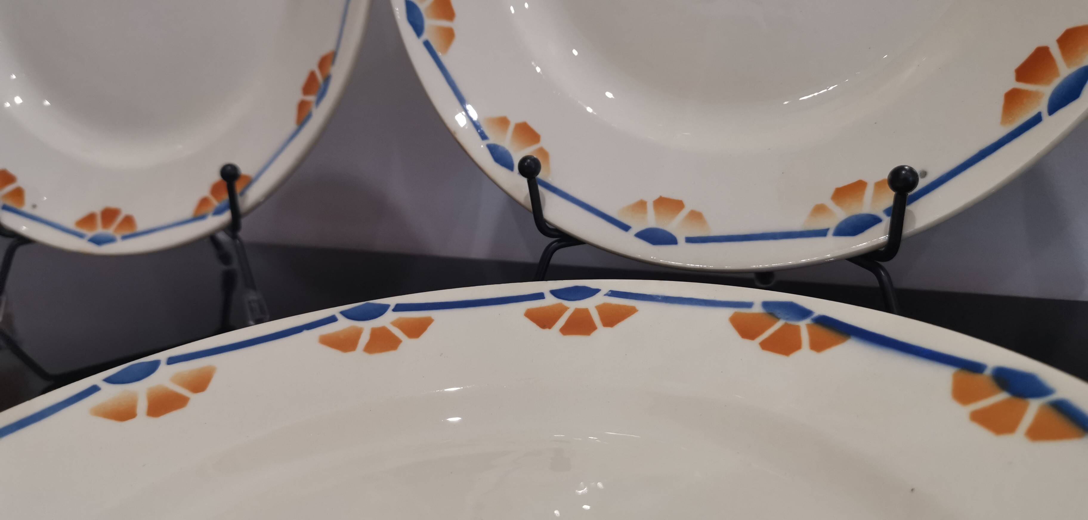 Old semi-deep plates in Terre de fer earthenware