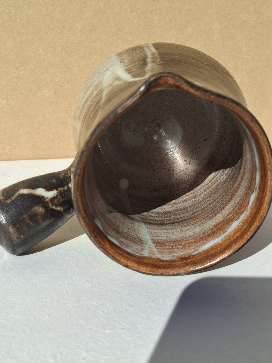 Stoneware pitcher signed by Jacques Pouchain.