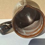 Stoneware pitcher signed by Jacques Pouchain.