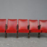 Series of 5 red skai and patinated cast Theater chairs