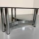 Round coffee table in smoked glass and chrome steel, 1970s design.
