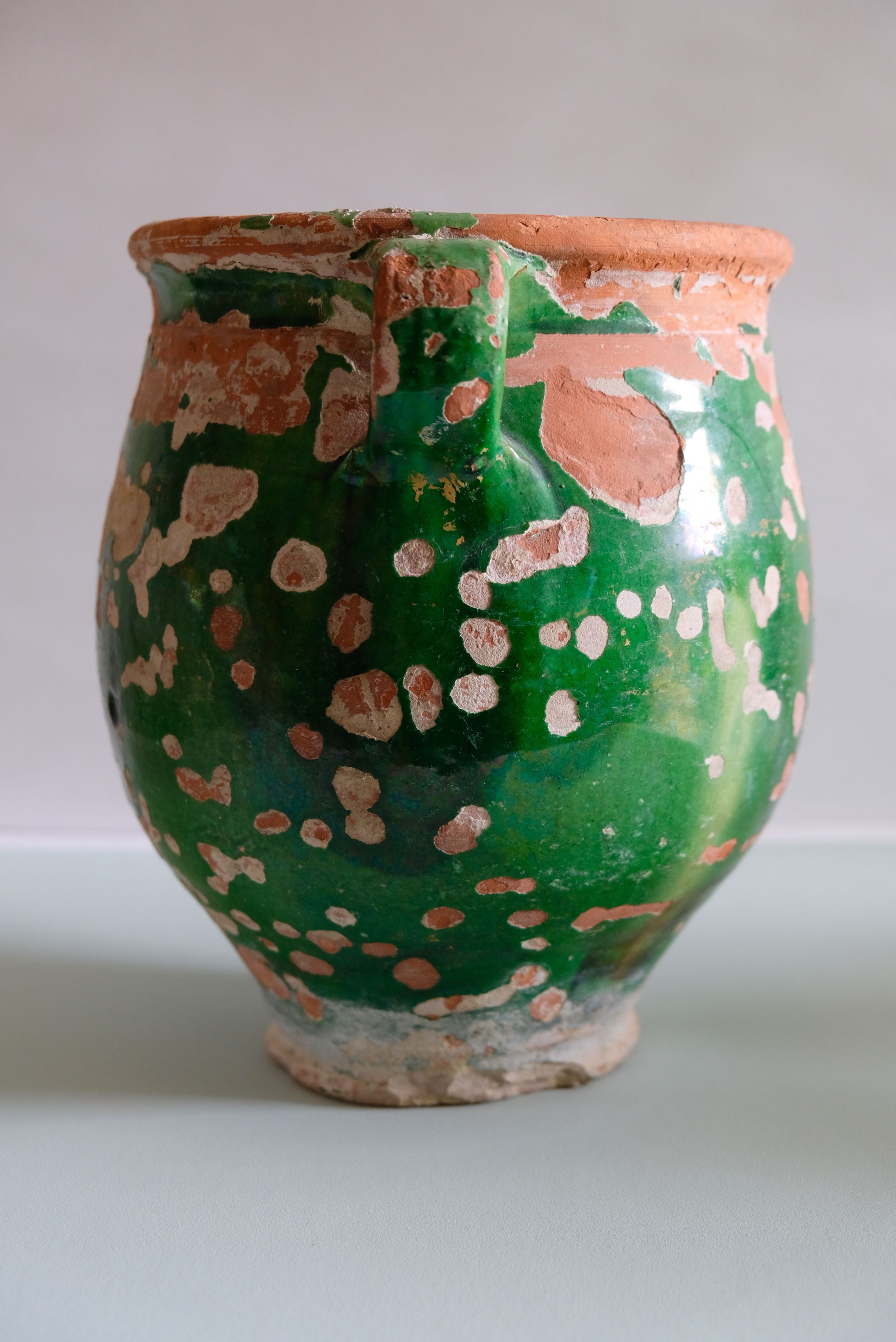 Ancient jar olive in provencal glazed terracotta, glazed green of the 19th century