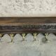 Vintage wall-mounted coat rack in solid wood.