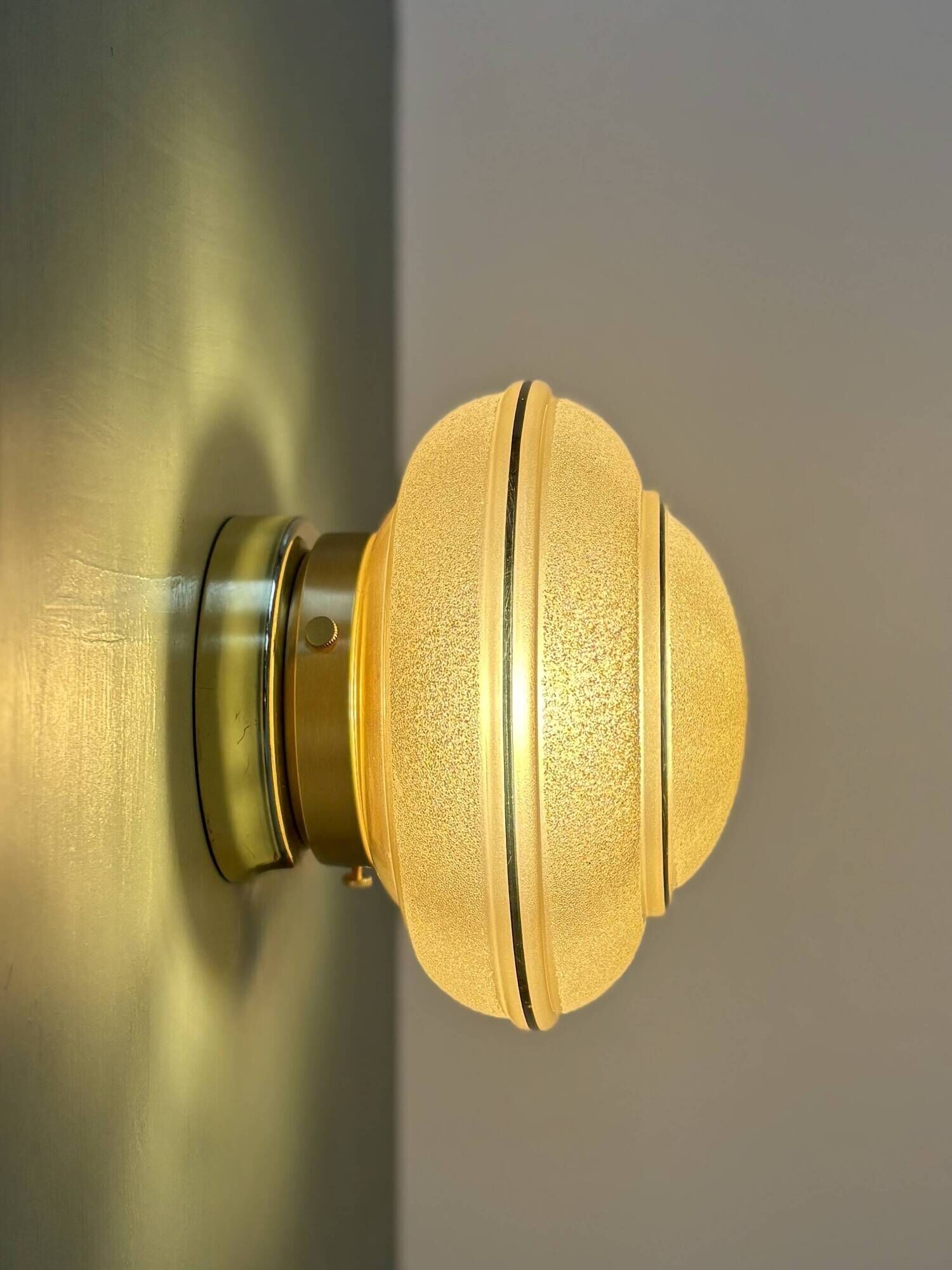 Vintage Art Deco globe wall/ceiling light in frosted yellow and gold glass.