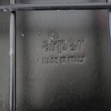 Red leather dining chairs by Arper