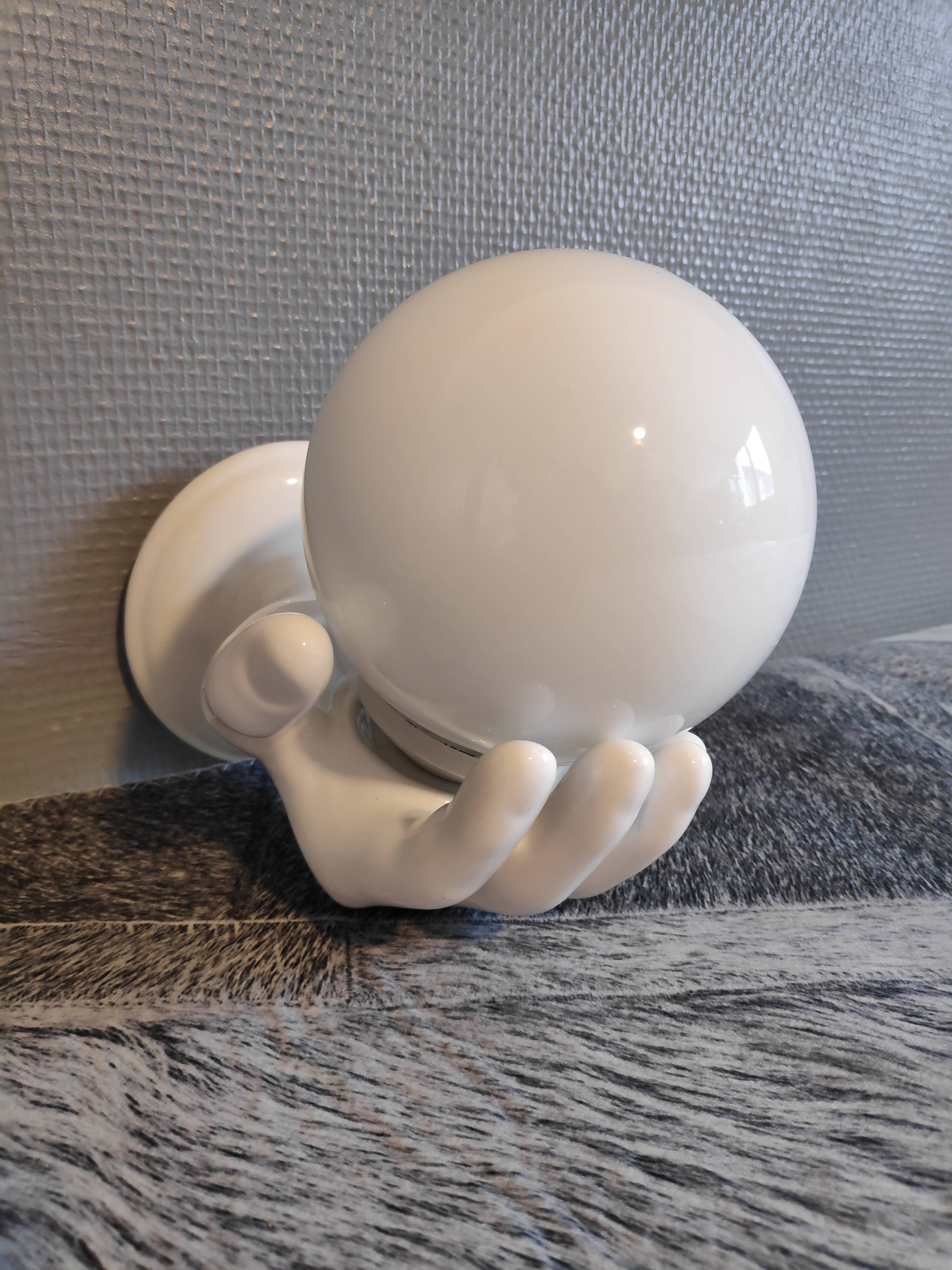 White ceramic hand sconce with white opaline globe
