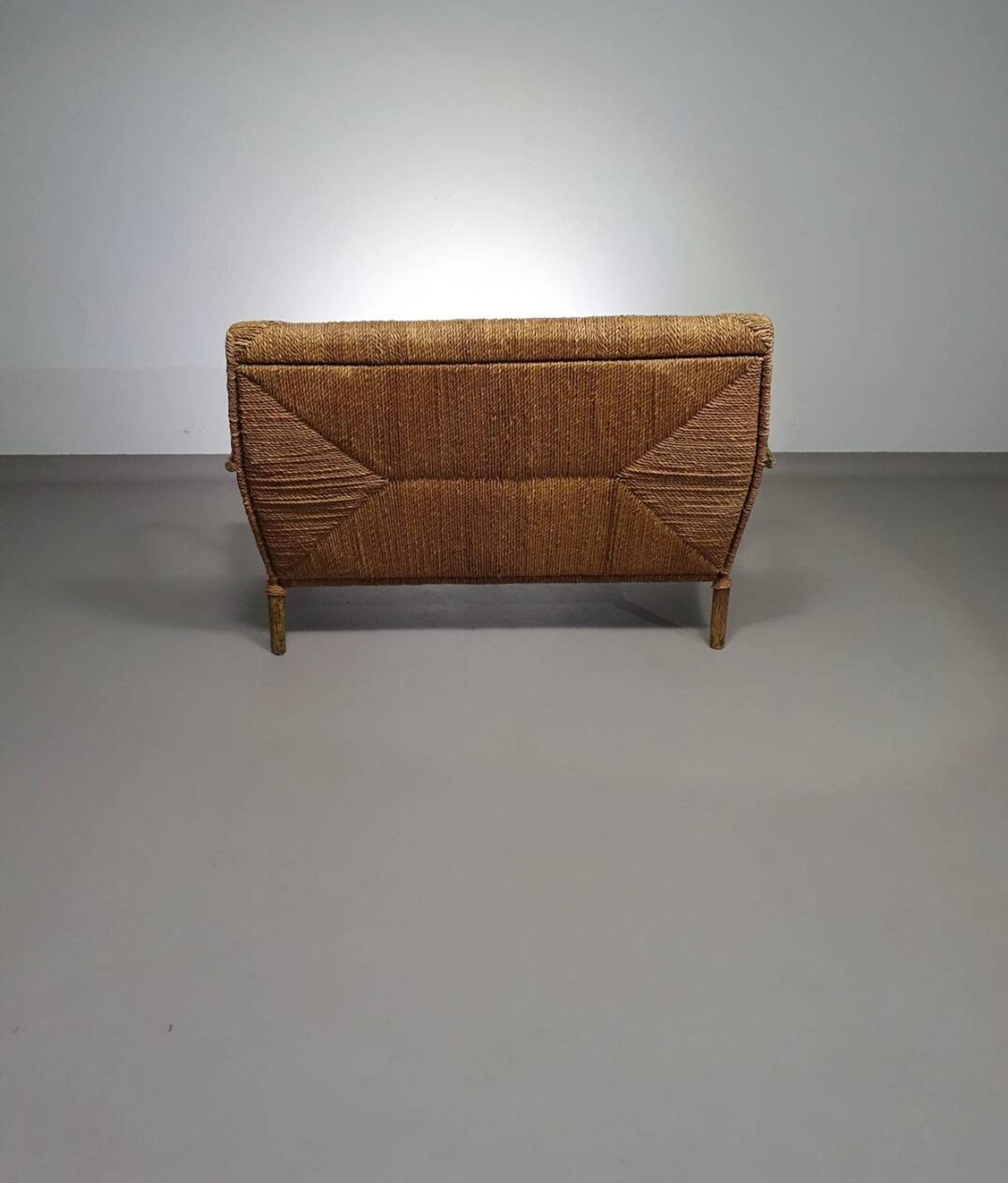 Vintage French papercord sofa with a metal frame base