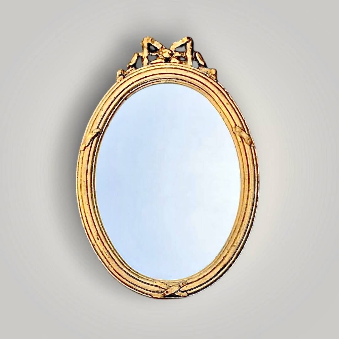 Antique oval wall mirror in gilded resin – Louis XVI knot –