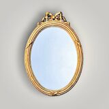 Antique oval wall mirror in gilded resin – Louis XVI knot –