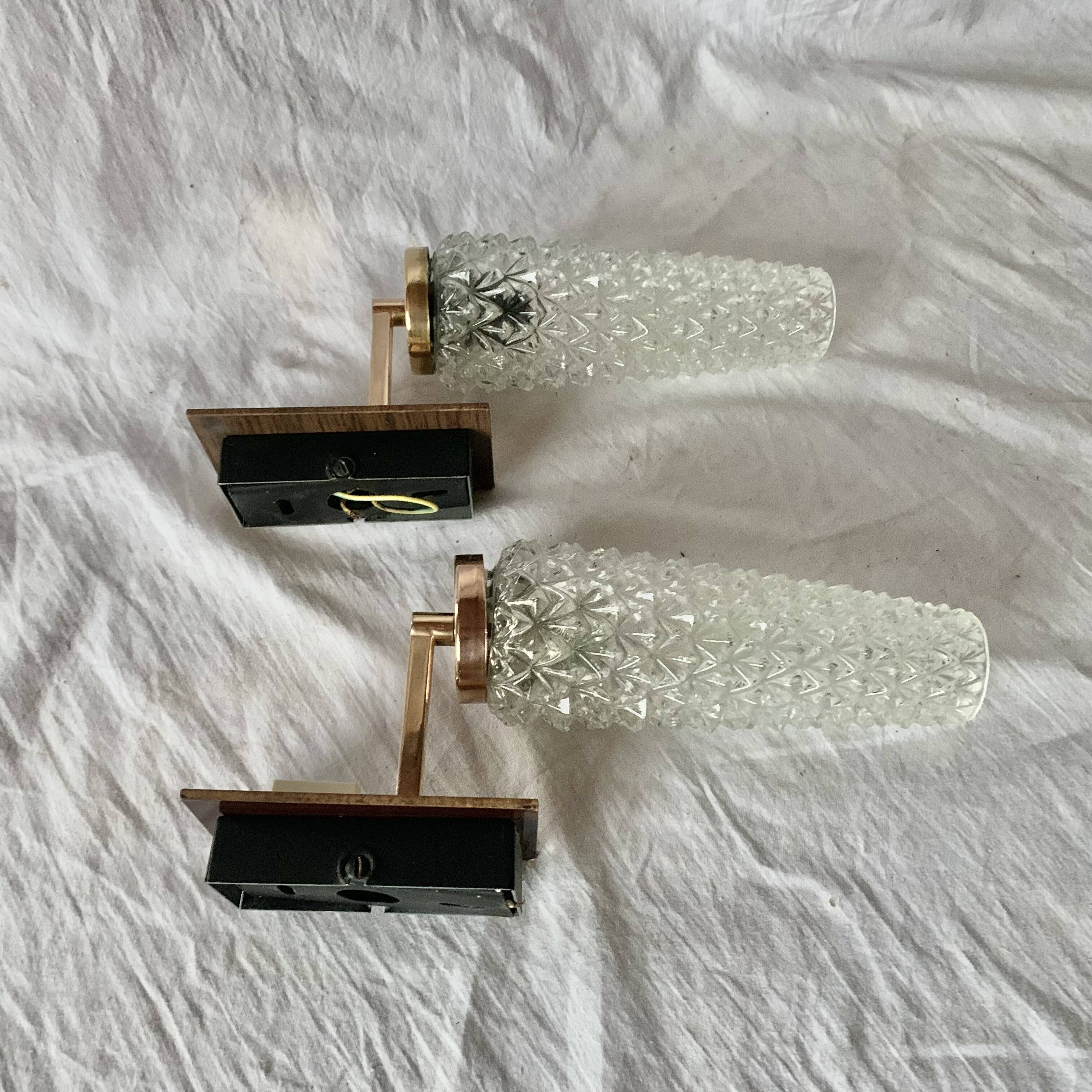 Pair of vintage wall sconces in molded glass and gilded brass