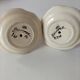Pair of HB Quimper egg cups with integrated pedestal base, floral decoration