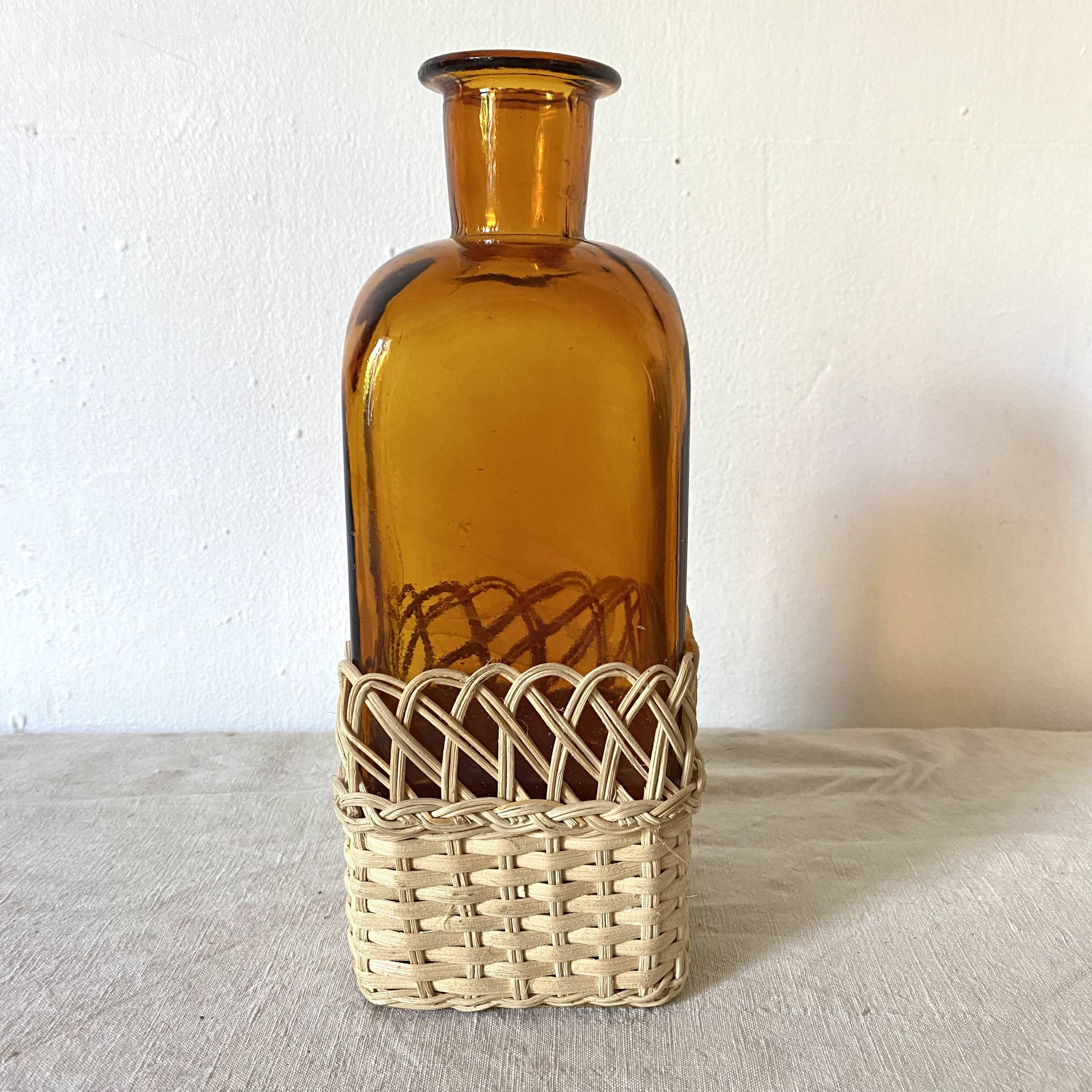 Amber glass and rattan carafe