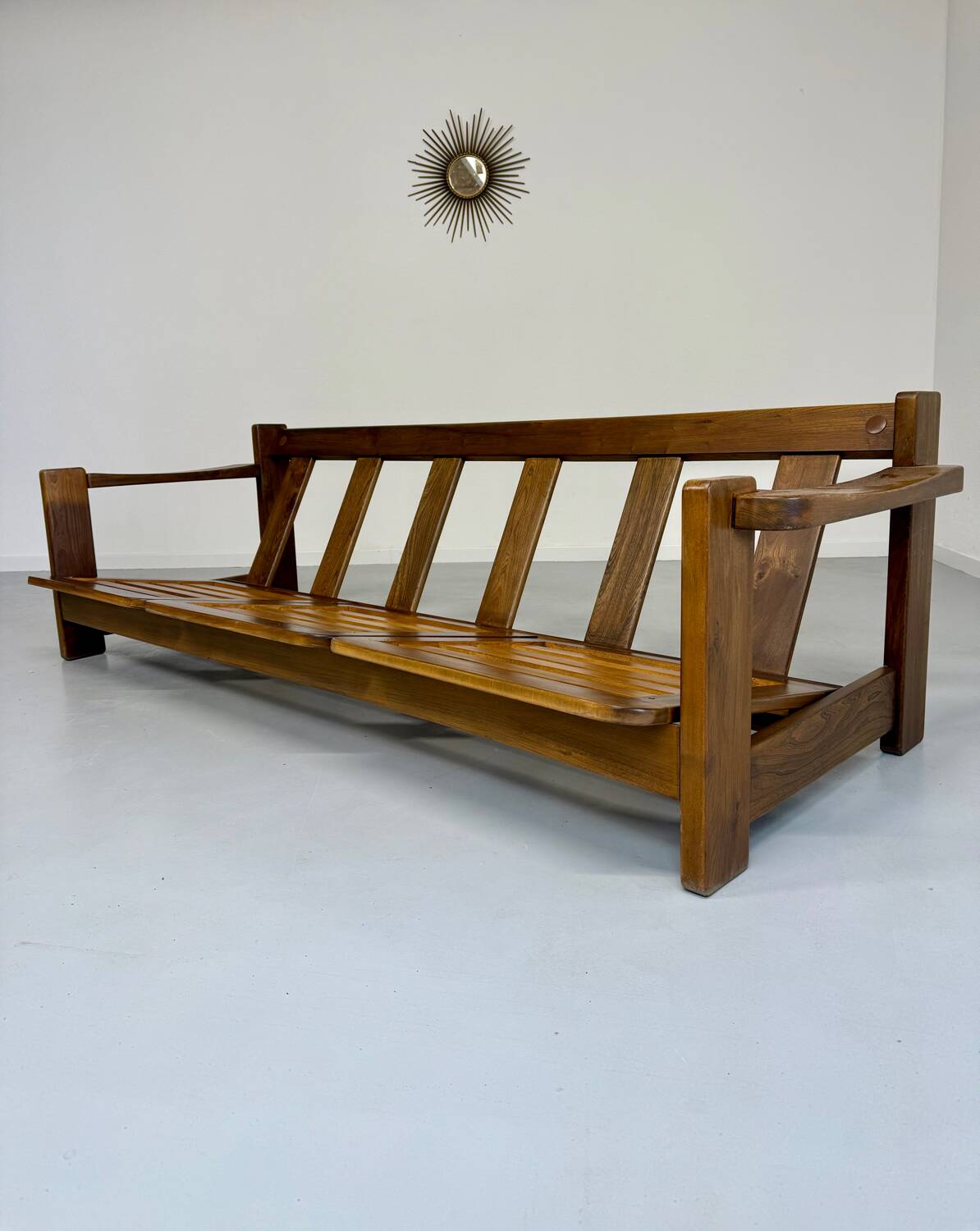 Old 3-seater sofa in solid wood, Maison Regain design, from the 70s.