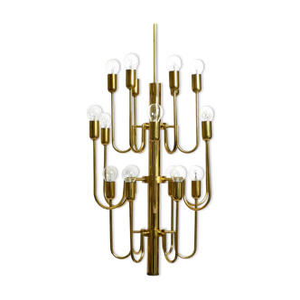 Three staged 18 arm Mid Century brass chandelier with a long brass rod