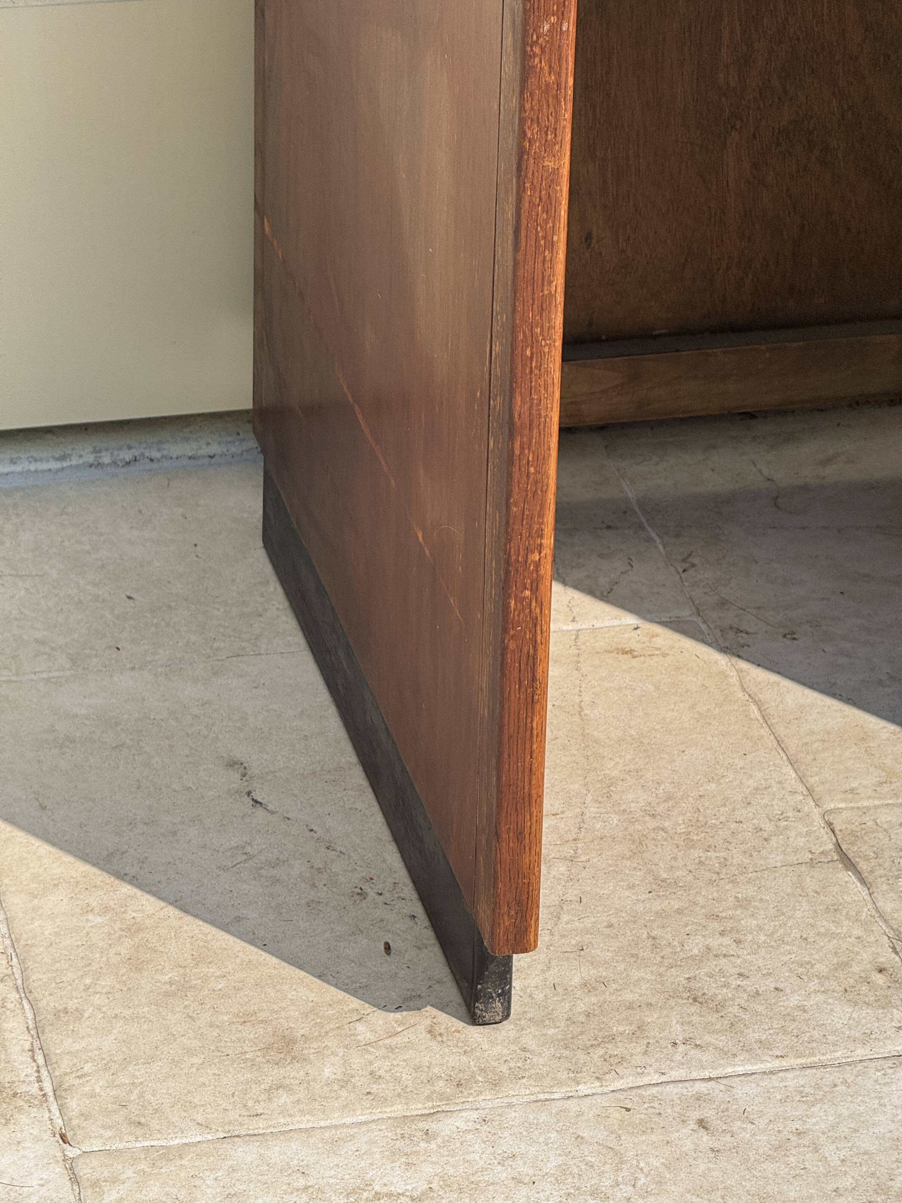 Modernist desk in wood and green moleskin upholstery