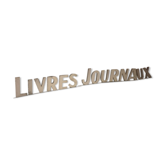 Old store sign "livres journaux"
