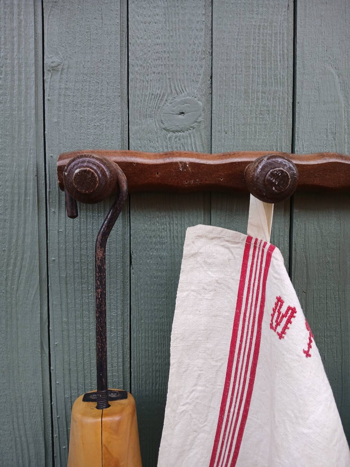 Small antique wooden wall coat rack.