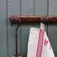 Small antique wooden wall coat rack.