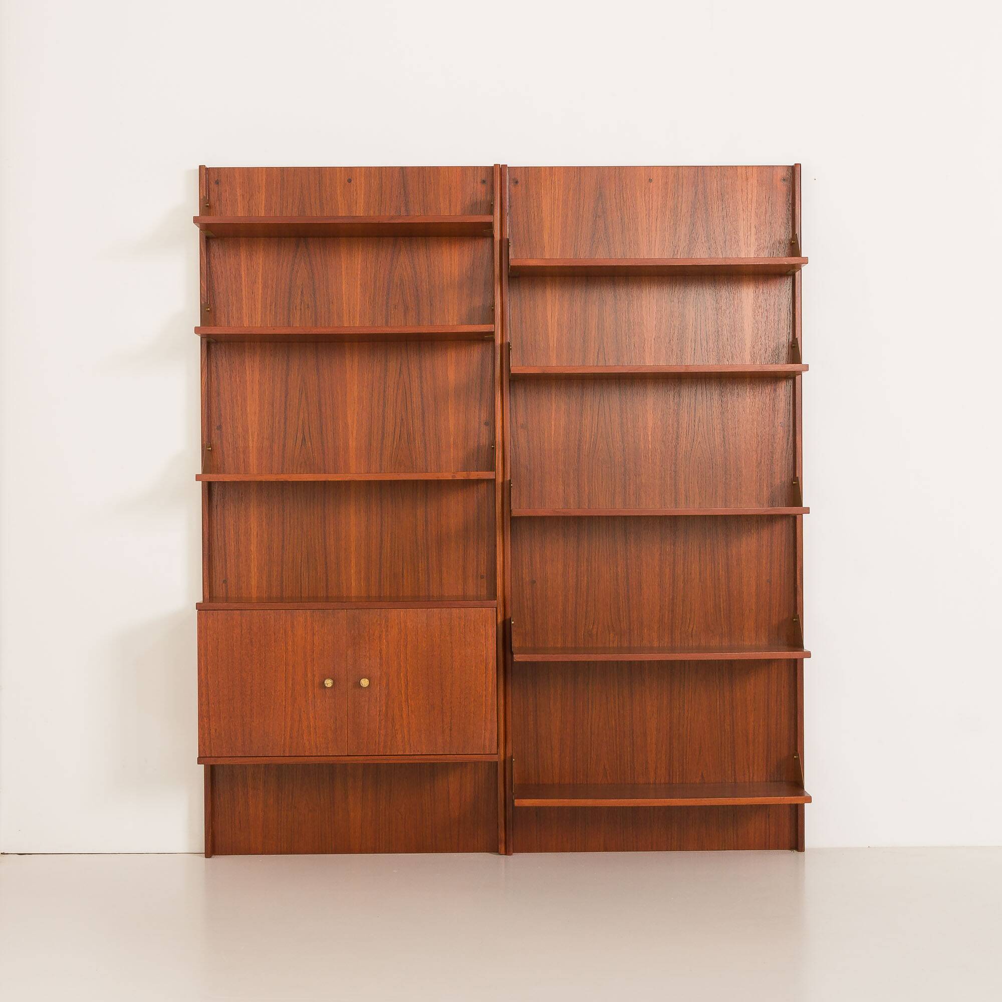 Italian mid-century teak wall unit on panels, 1970s