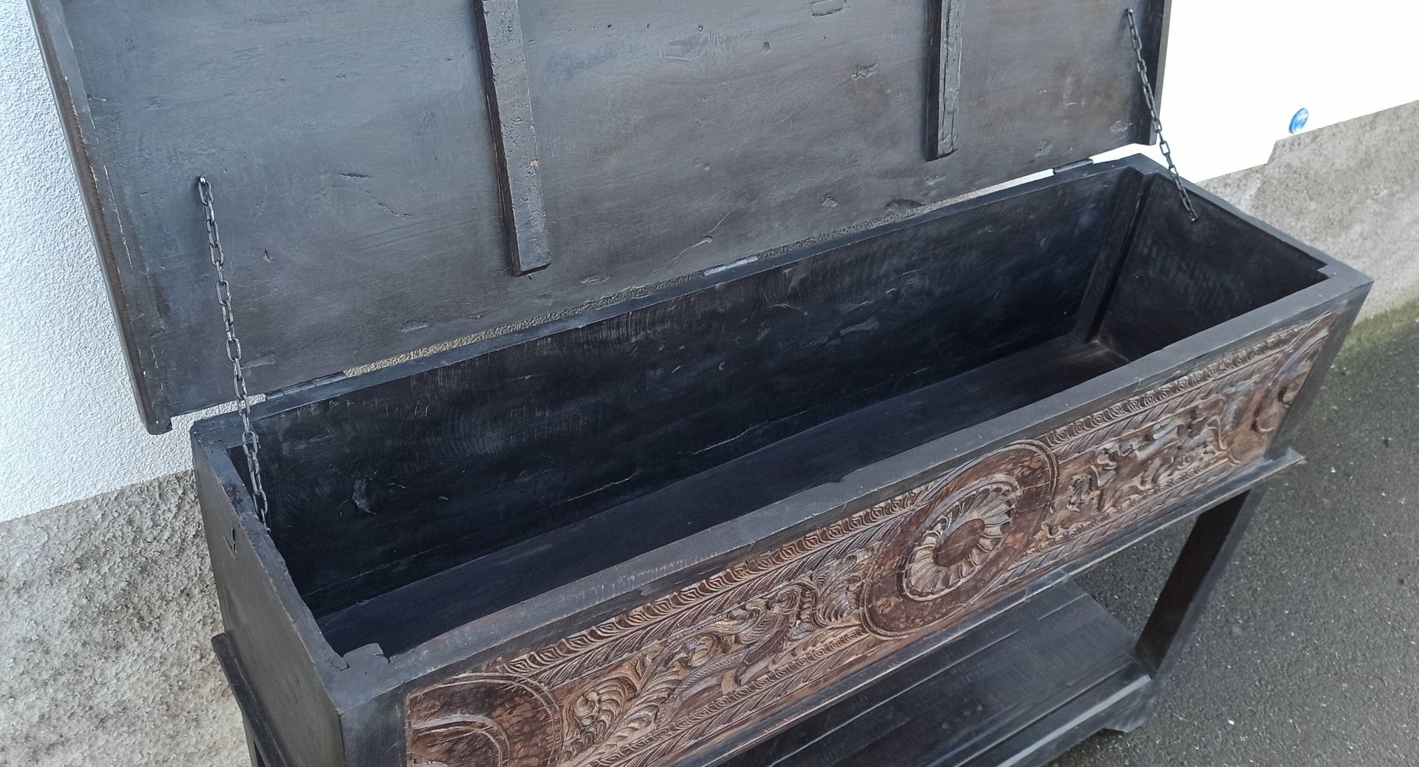 Console in old black wood with integrated chest
