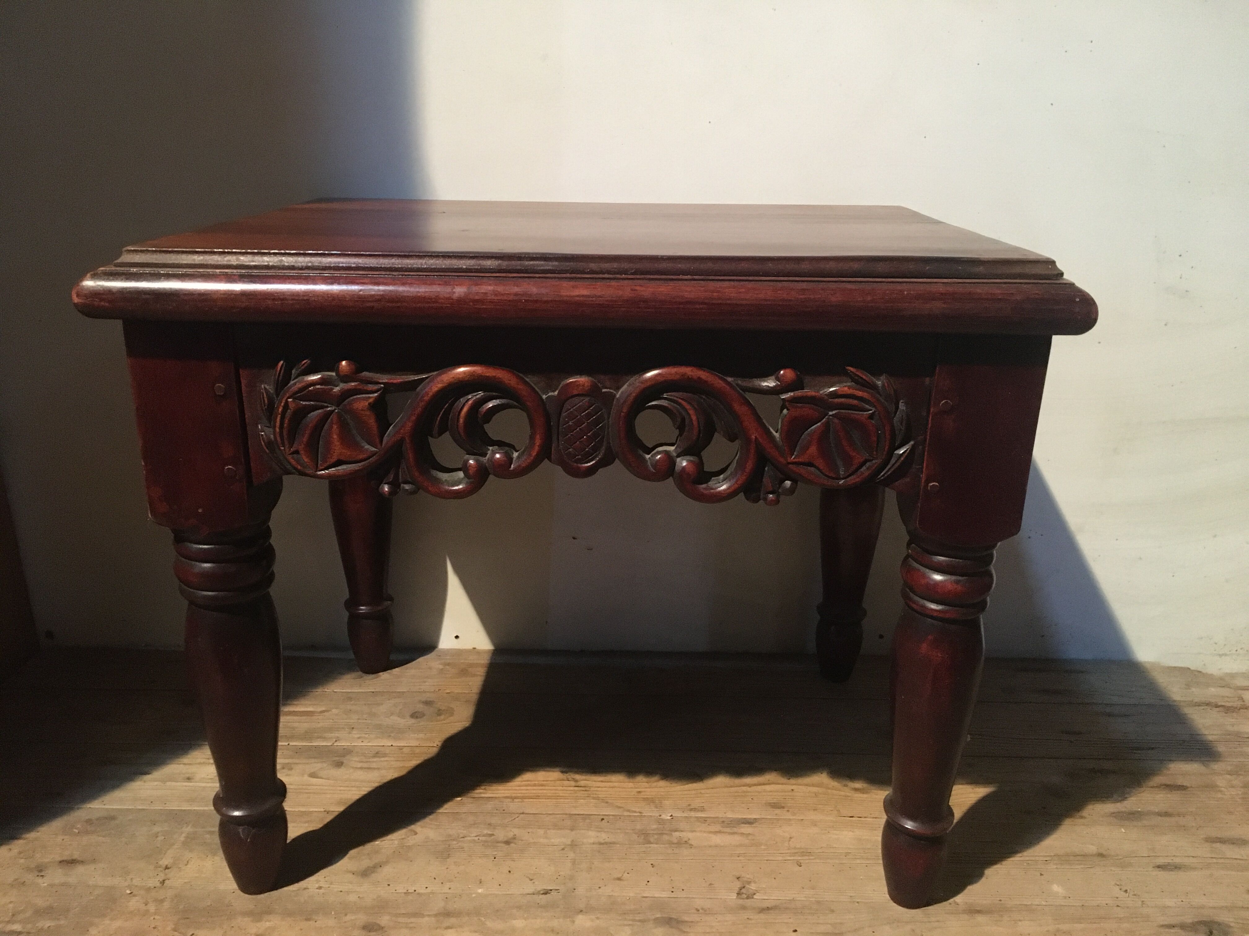 Carved wooden sofa end, mahogany