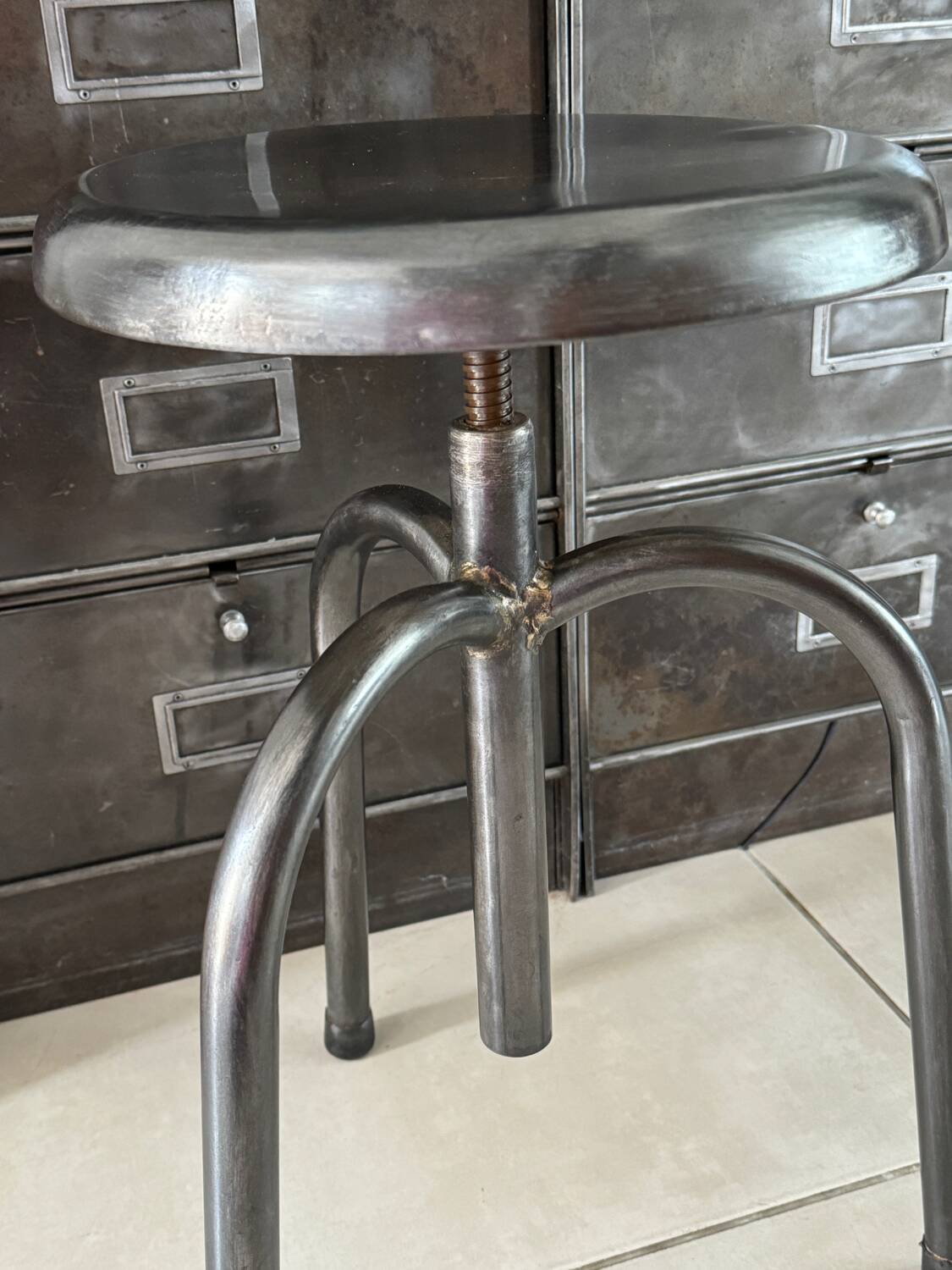 Height-adjustable tripod metal stool