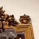 Antique English golden barock mirror mirror with large ornament