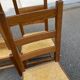 4 solid wood and straw chairs, farmhouse style from the 1950s.
