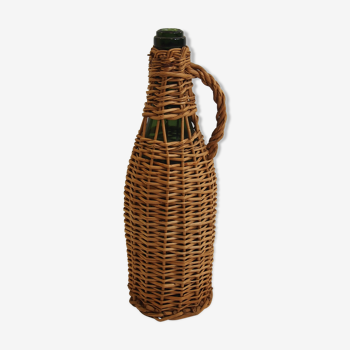 Bottle dressed in rattan