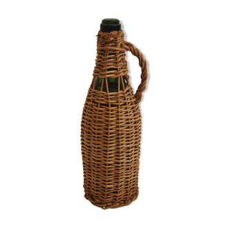 Bottle dressed in rattan