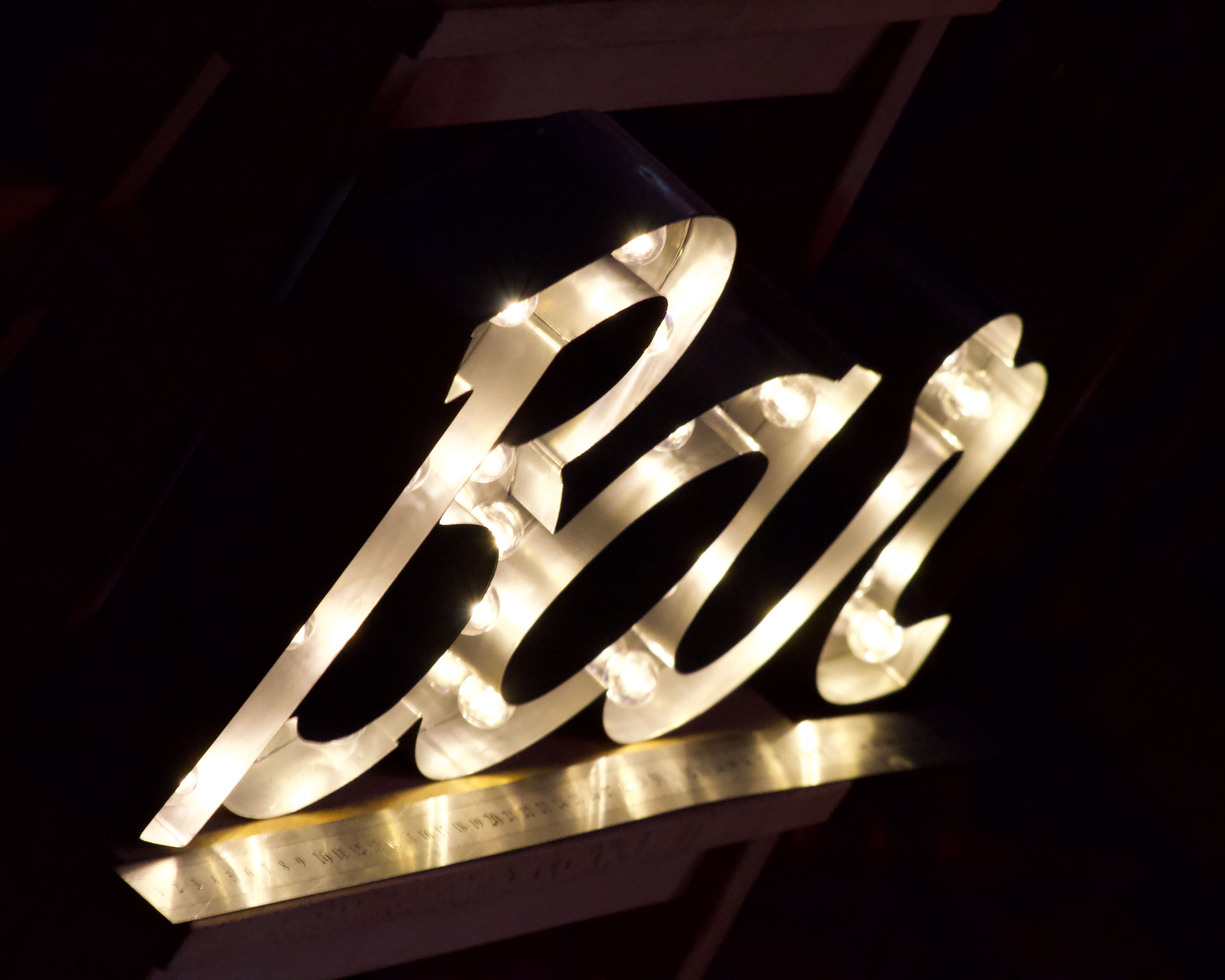 Ancient Light Sign in aluminium lettering forming the word "BAR"