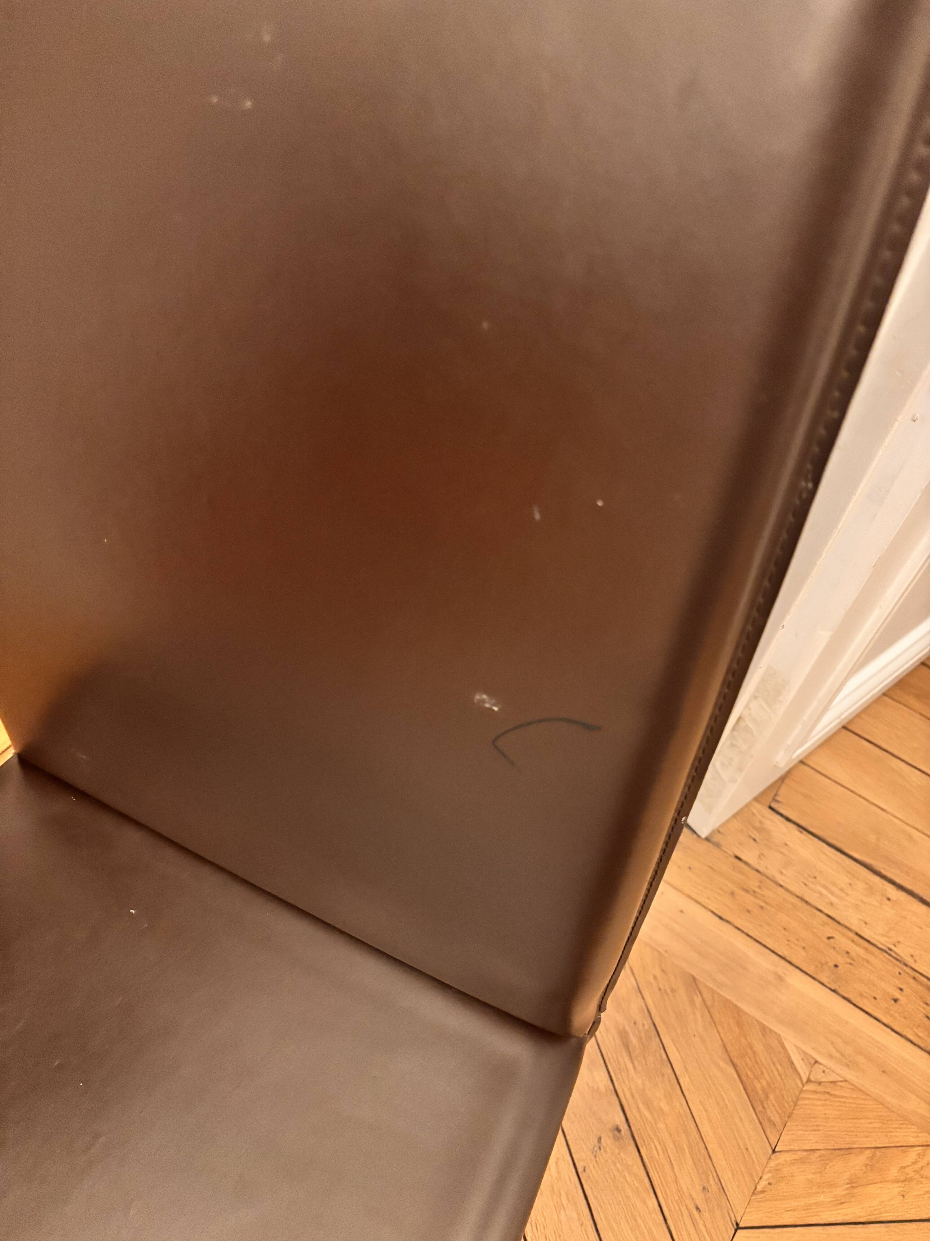 Many brown leather chairs "Roche Bobois"